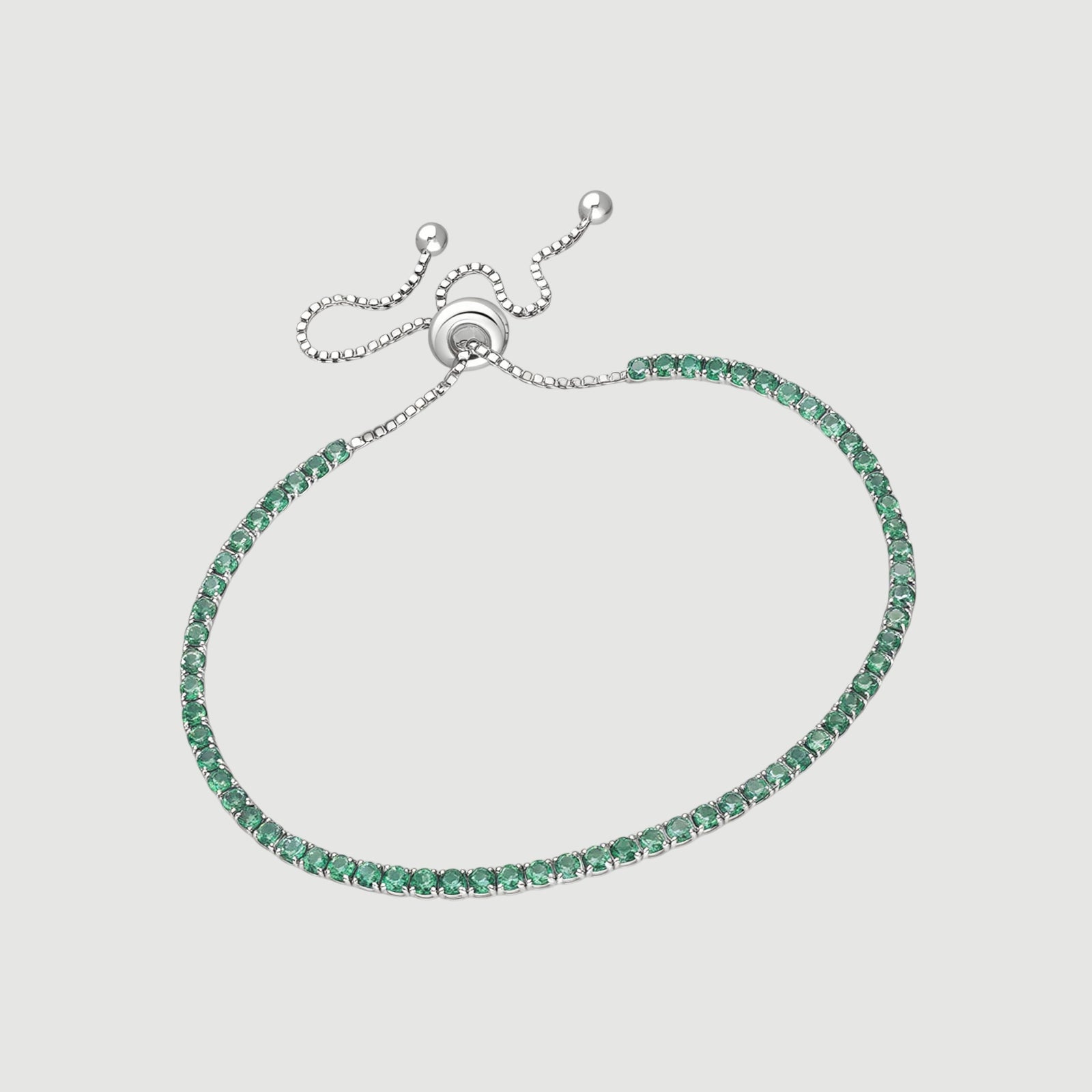 Amara Jewels sterling silver adjustable tennis bracelet with forest green gemstones and a slider clasp.
