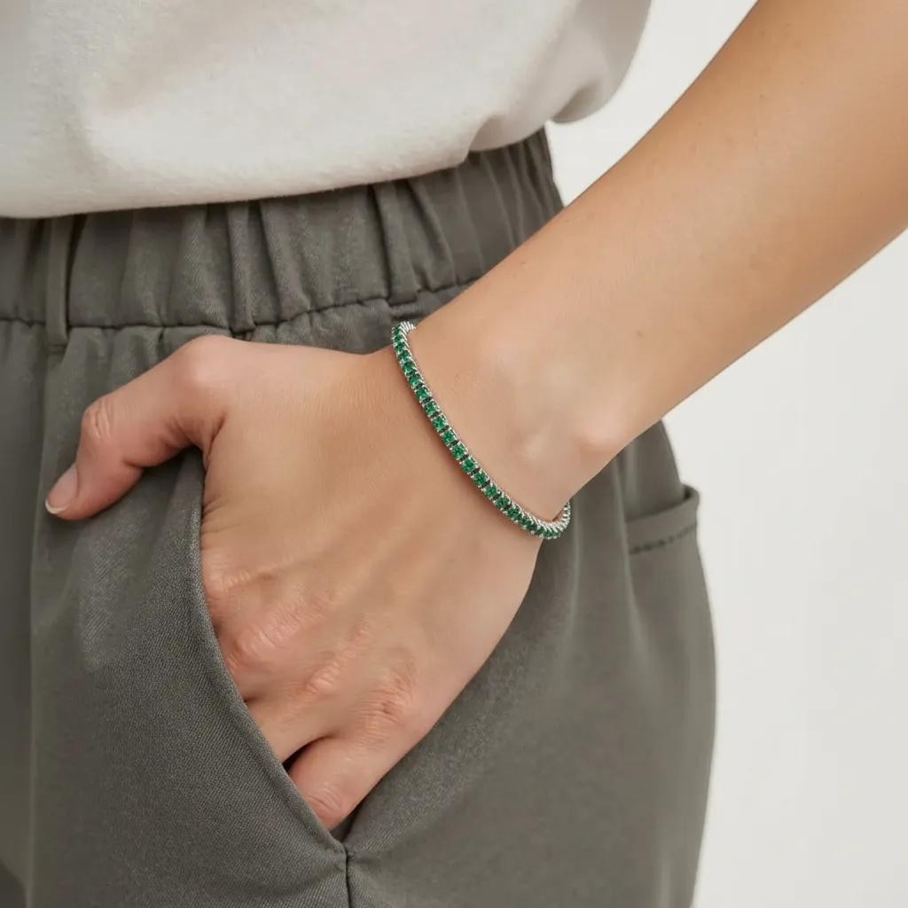 Amara Jewels sterling silver adjustable tennis bracelet with forest green gemstones and a slider clasp.