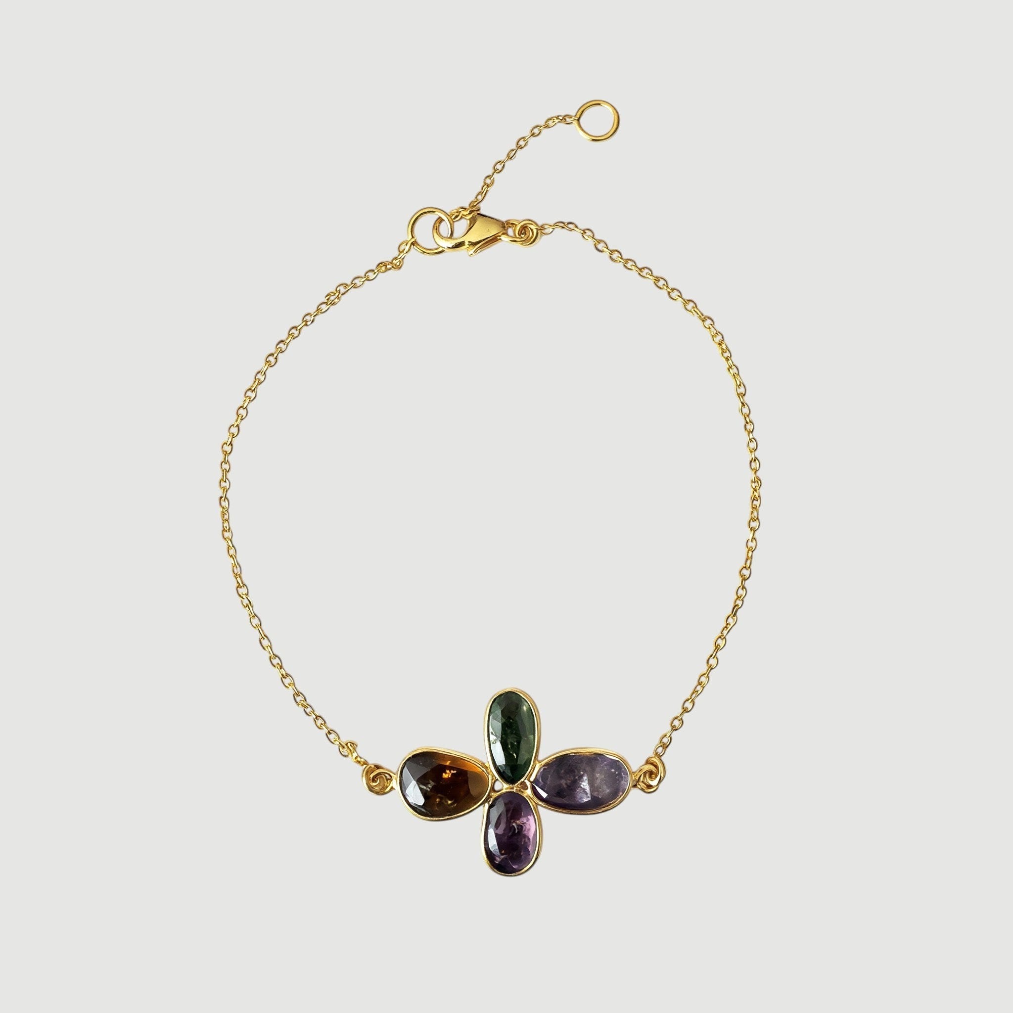 Amara Jewels Harmony Gemstone Bracelet in gold vermeil sterling silver with multi-colored natural gemstones arranged in a floral pattern.