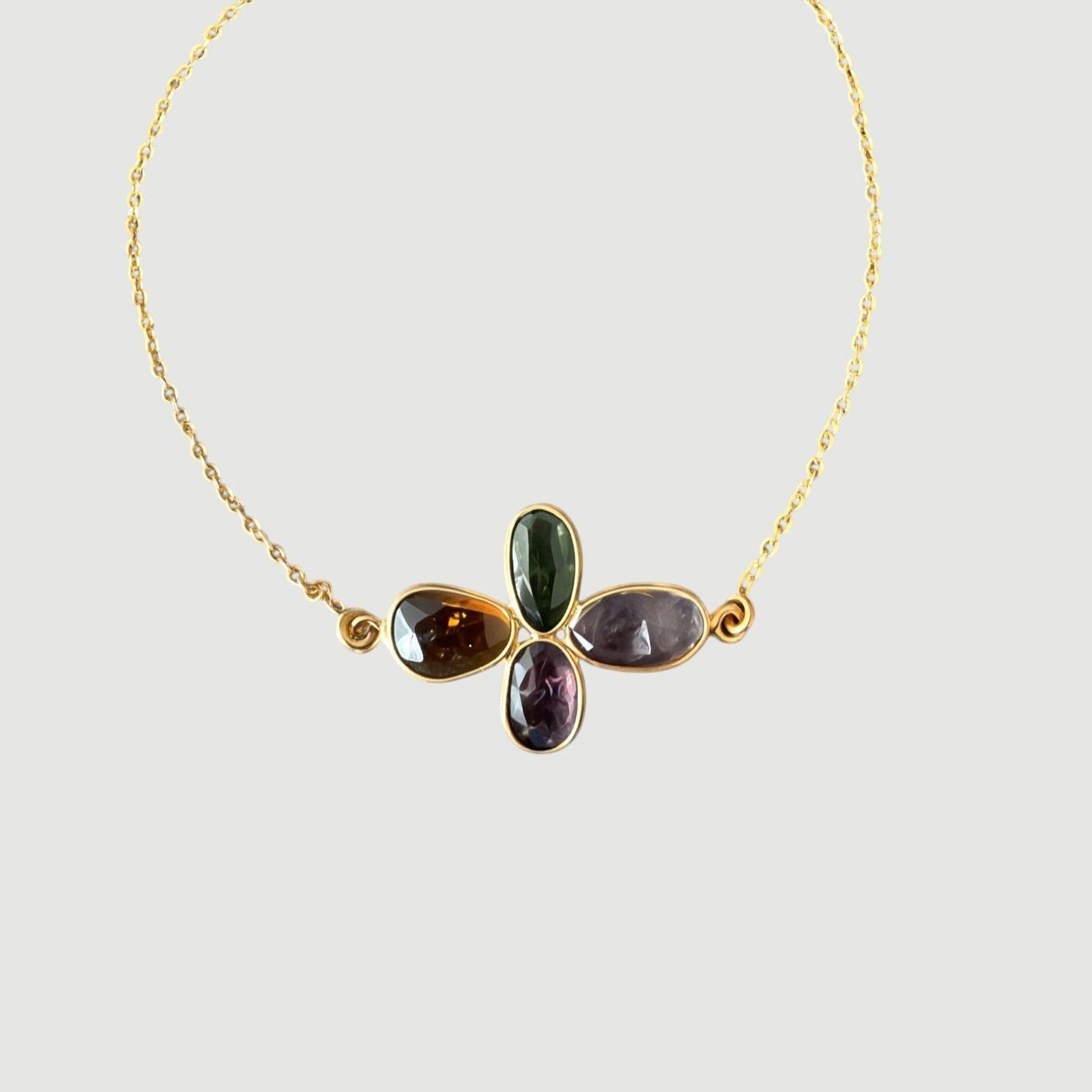 Amara Jewels Harmony Gemstone Bracelet in gold vermeil sterling silver with multi-colored natural gemstones arranged in a floral pattern.