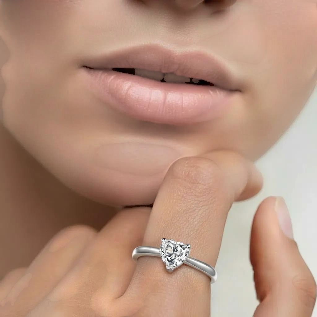 Amara Jewels sterling silver ring with a heart-shaped clear zircon solitaire.