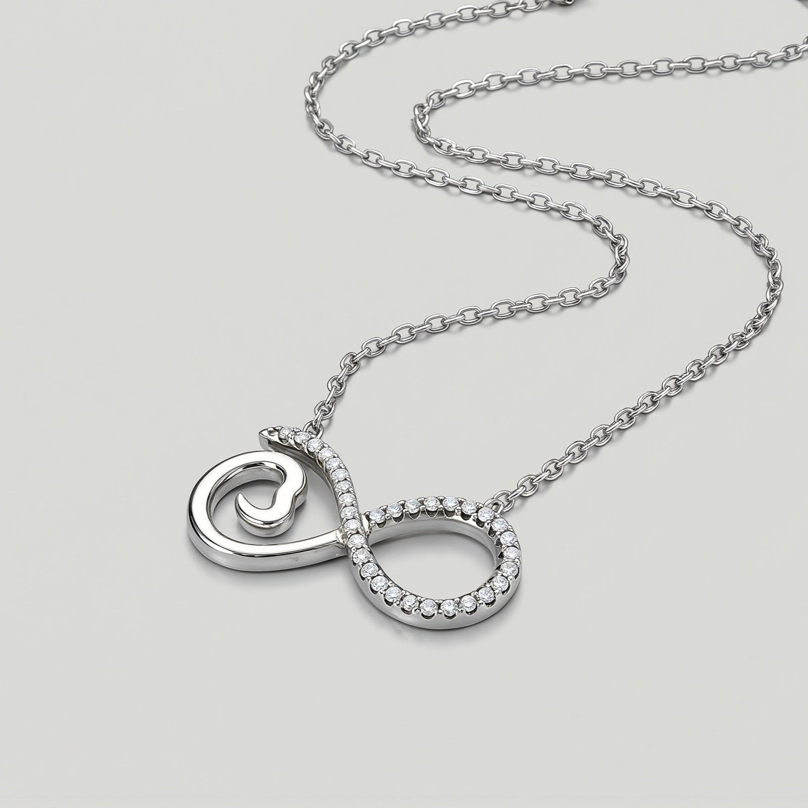 Amara Jewels sterling silver infinity heart necklace with cubic zirconia accents and a delicate chain.
