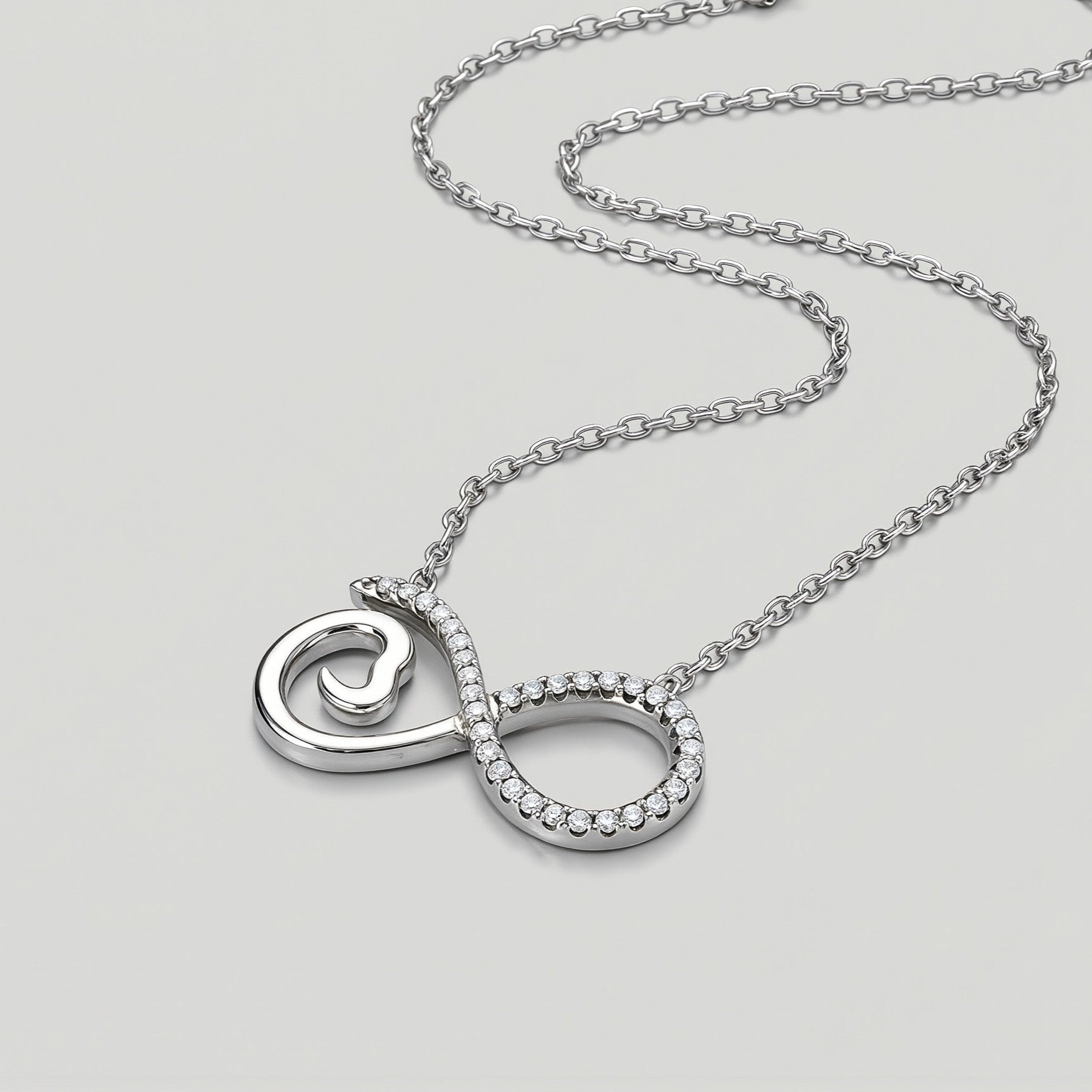 Amara Jewels sterling silver infinity heart necklace with cubic zirconia accents and a delicate chain.