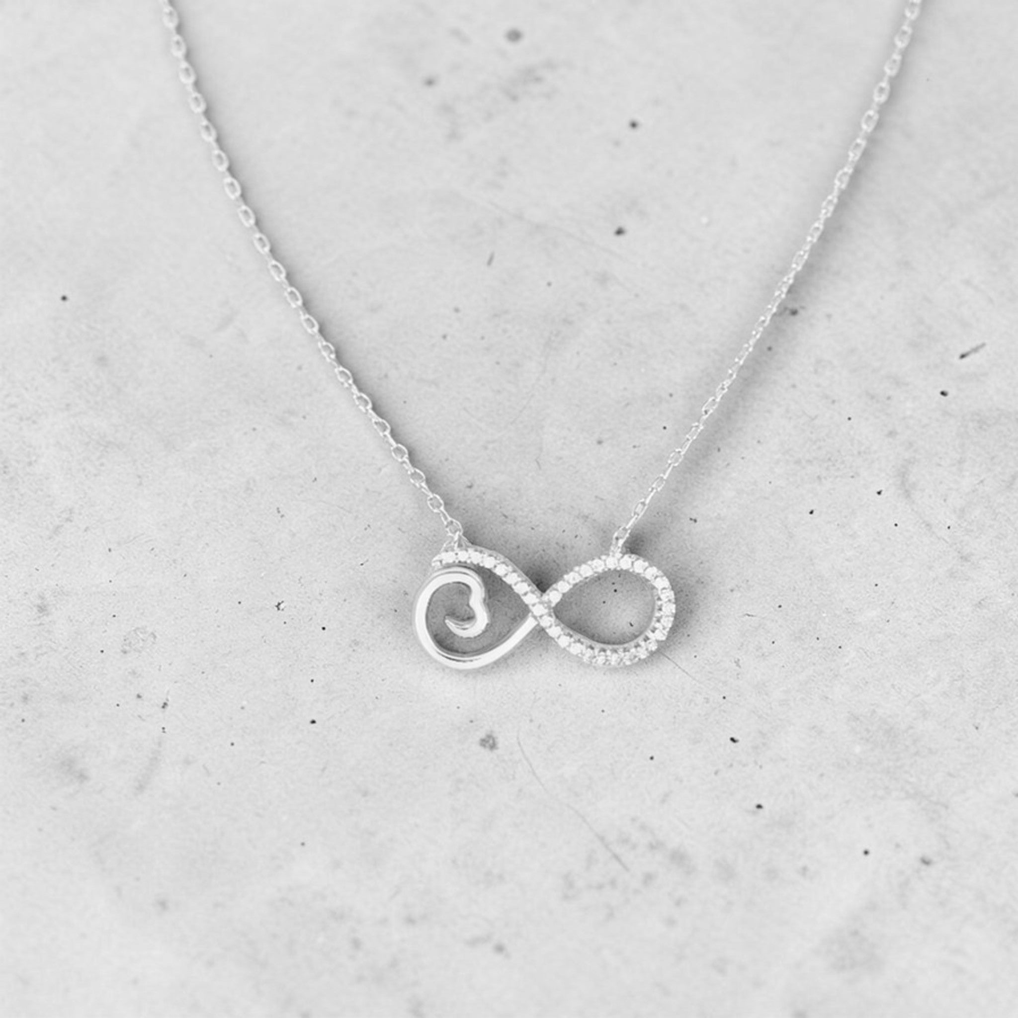 Amara Jewels sterling silver infinity heart necklace with cubic zirconia accents and a delicate chain.