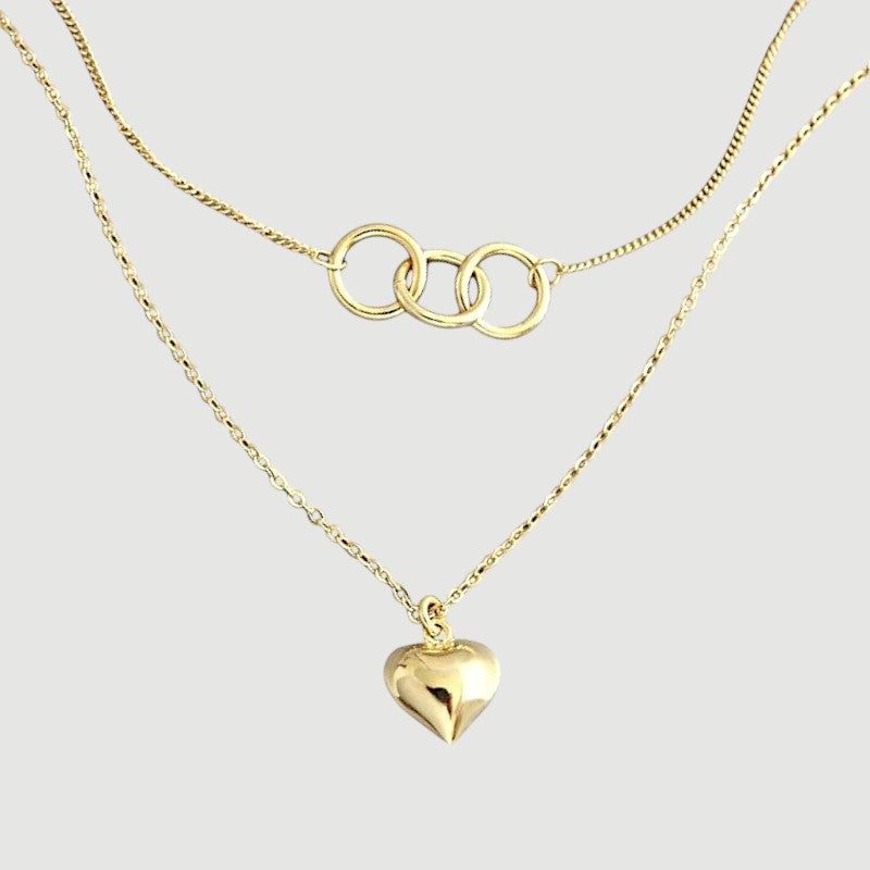 Amara Jewels gold-plated sterling silver layered necklace with heart and interlocking circles pendants.
