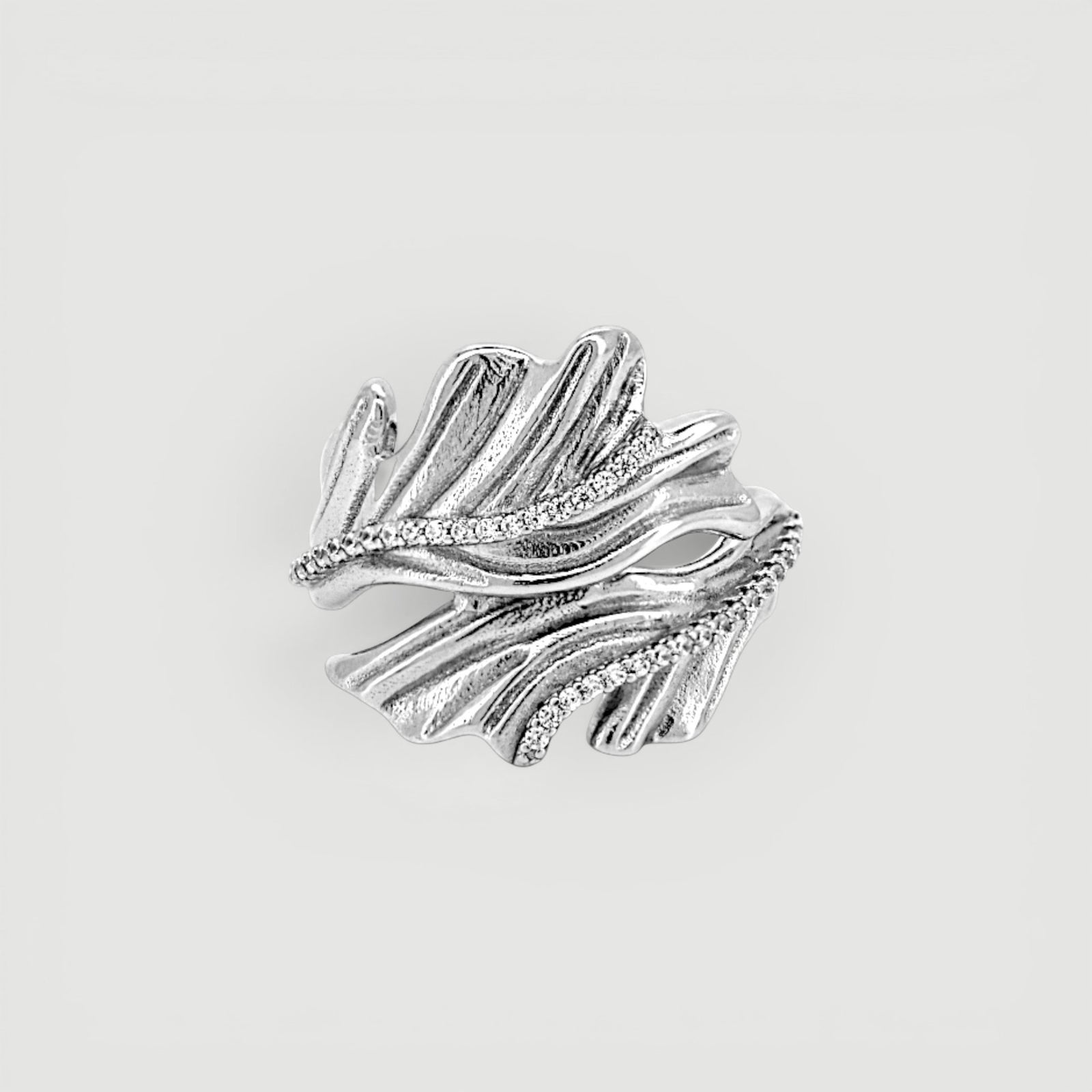Amara Jewels sterling silver open ring with leaf design and sparkling accent stones.