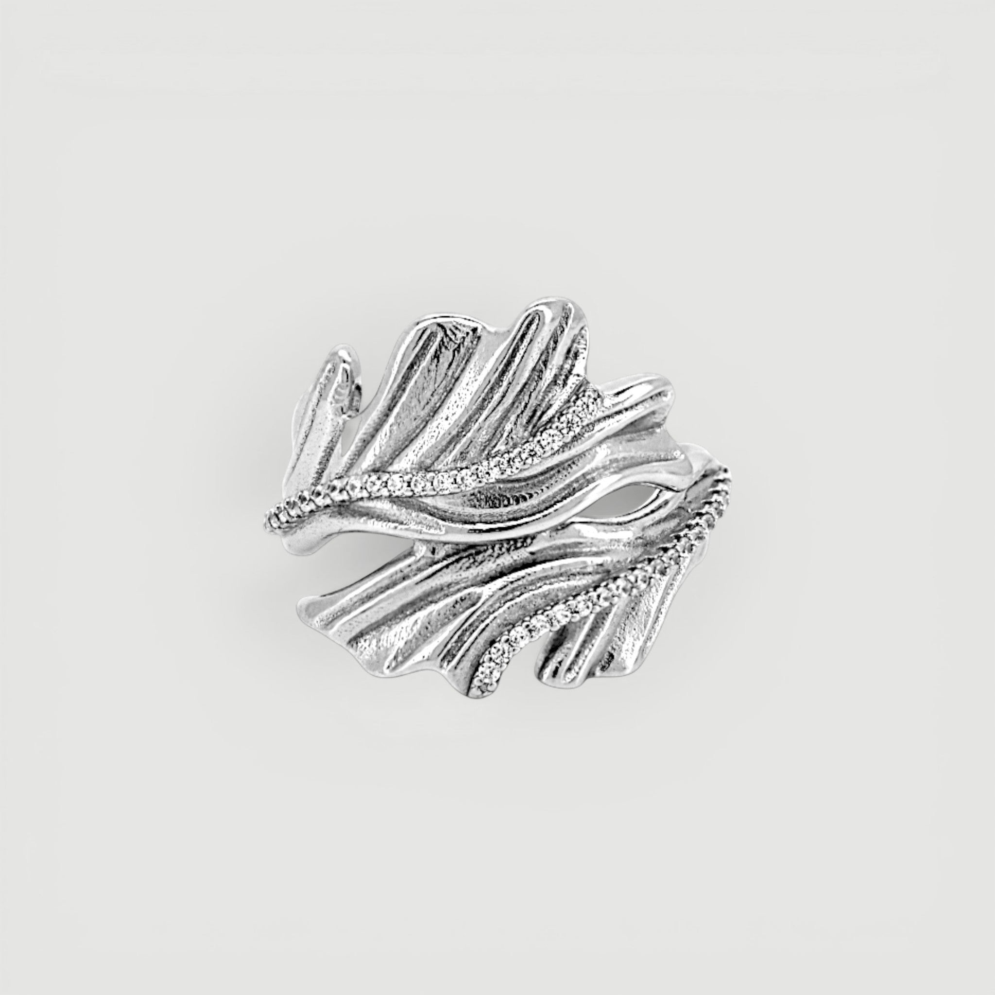 Amara Jewels sterling silver open ring with leaf design and sparkling accent stones.