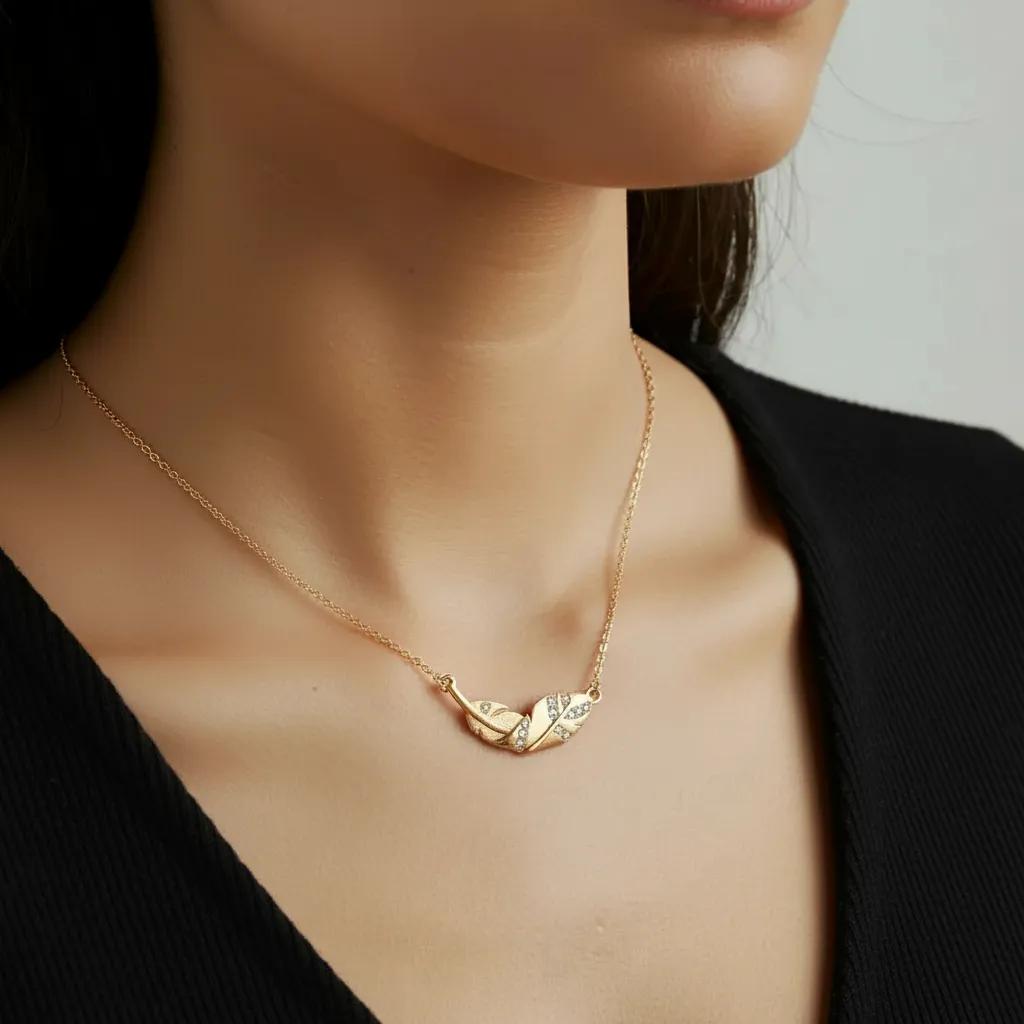 Amara Jewels gold-plated 925 sterling silver necklace with a leaf pendant adorned with cubic zirconia.