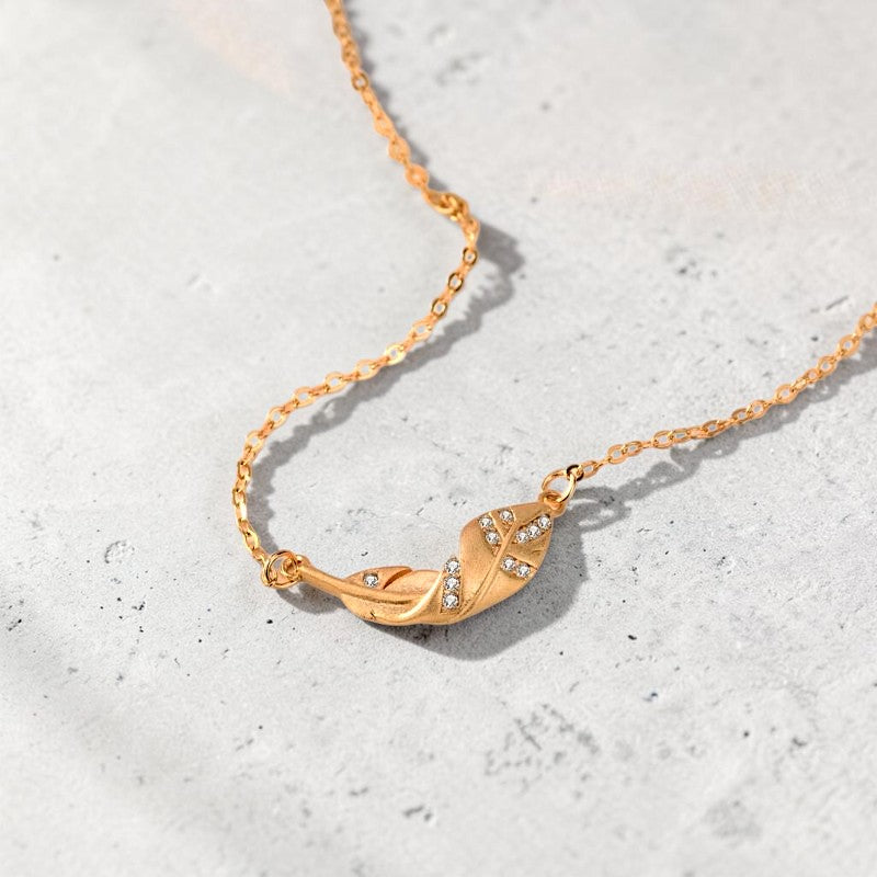 Amara Jewels gold-plated 925 sterling silver necklace with a leaf pendant adorned with cubic zirconia.