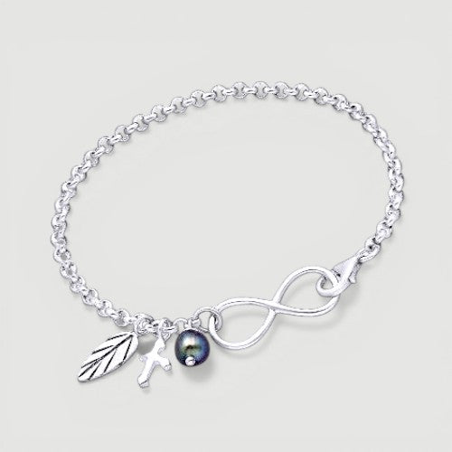Amara Jewels sterling silver bracelet with infinity symbol, leaf charm, cross charm, and black pearl.