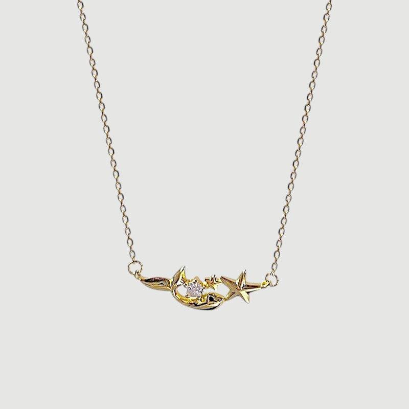 Amara Jewels gold plated sterling silver mermaid and star necklace with crystal accent.