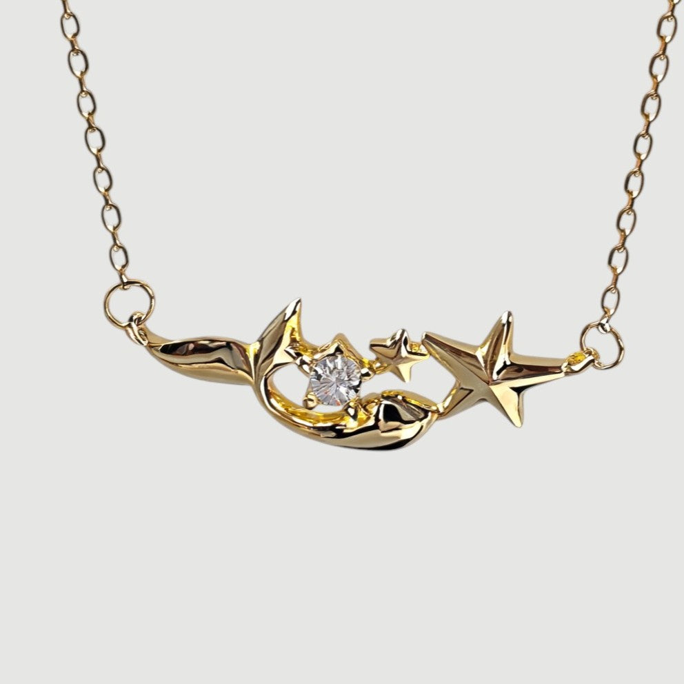 Amara Jewels gold plated sterling silver mermaid and star necklace with crystal accent.