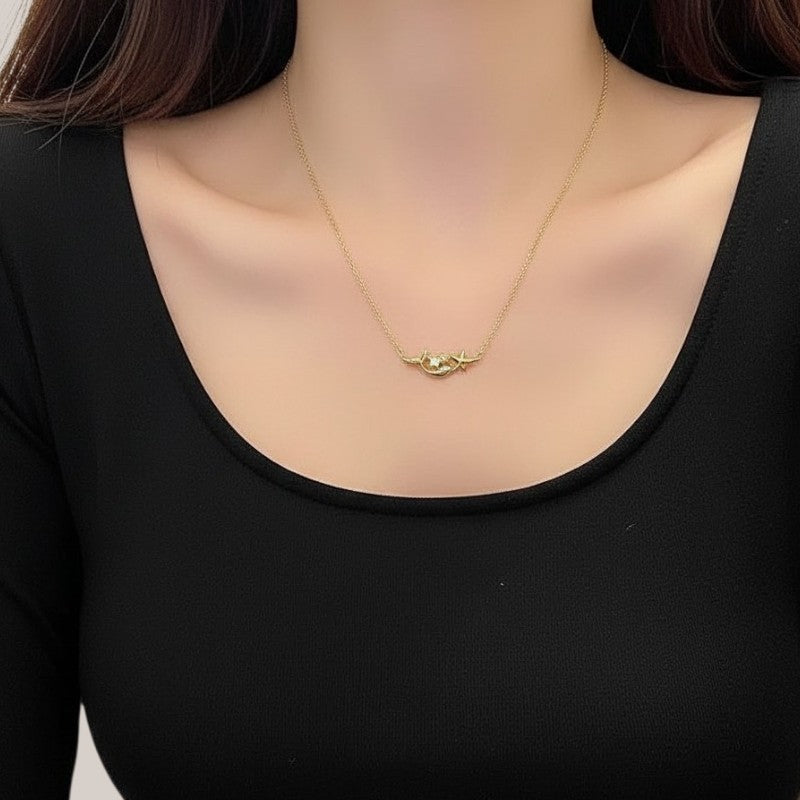 Amara Jewels gold plated sterling silver mermaid and star necklace with crystal accent.