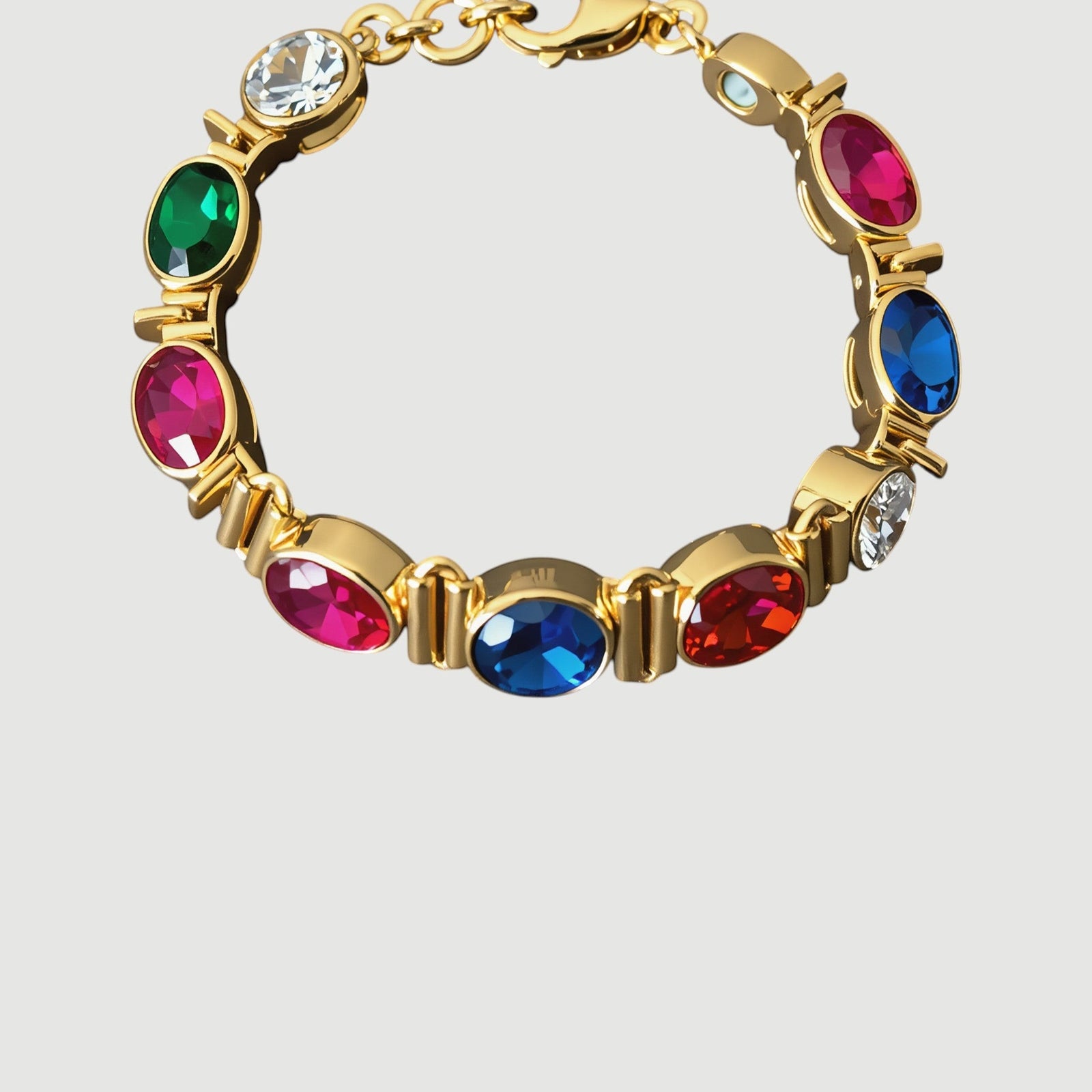 Amara Jewels multi-gemstone bracelet with oval-cut ruby, sapphire, emerald, citrine, peridot, and clear stones in 18K gold vermeil.