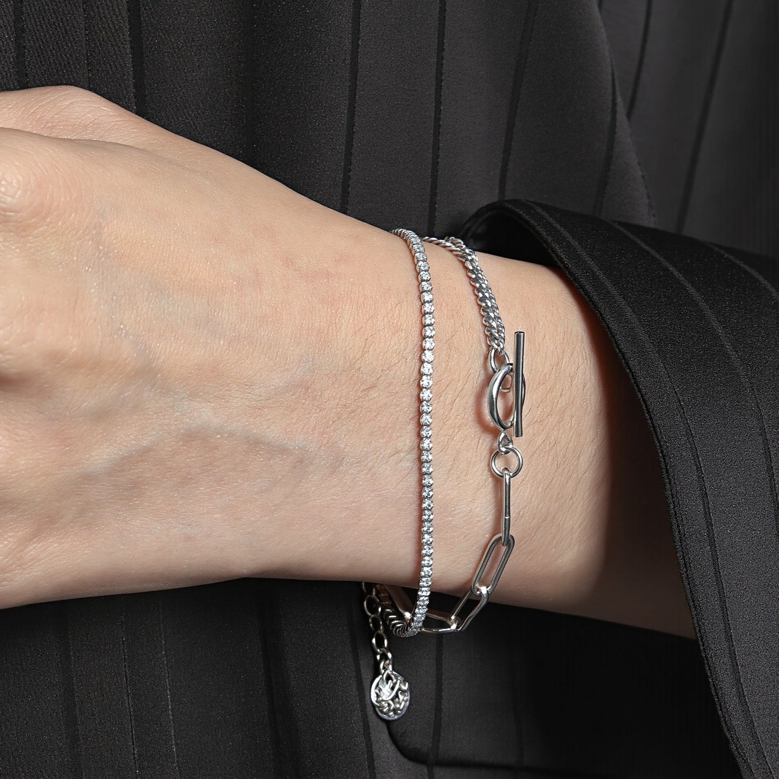 Amara Jewels layered chain sterling silver bracelet with toggle clasp featuring circle T charm.