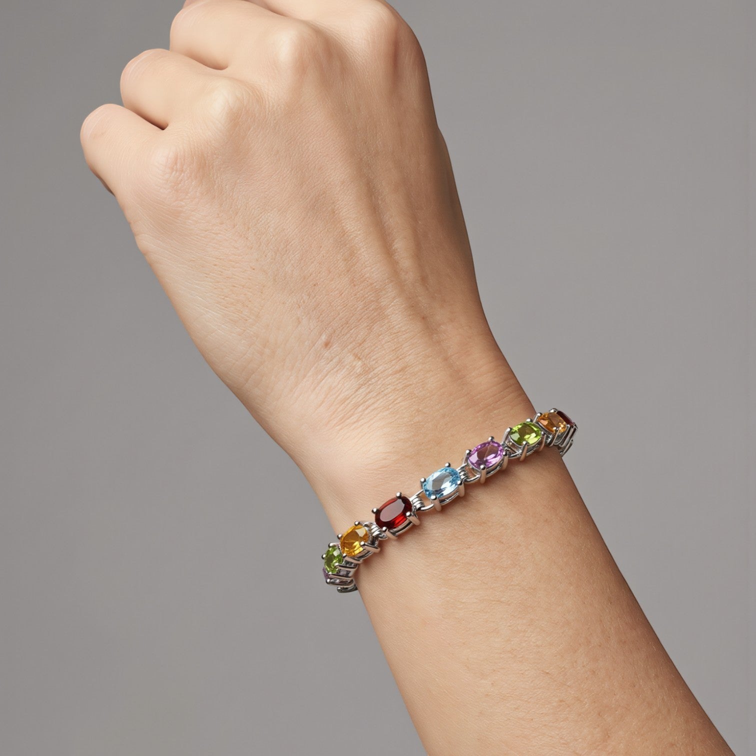 Amara Jewels multicolour oval gemstone tennis bracelet in 925 sterling silver, perfect for adding colour to any outfit.