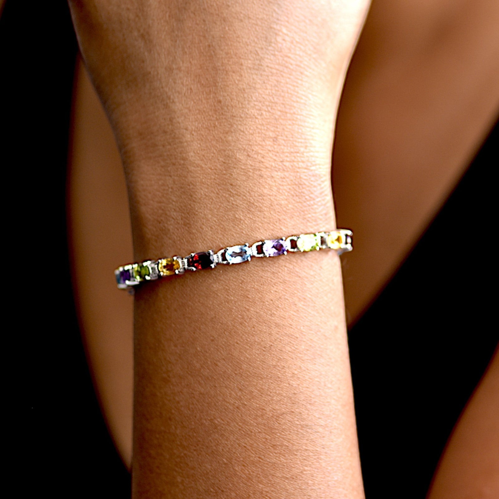 Amara Jewels multicolour oval gemstone tennis bracelet in 925 sterling silver, perfect for adding colour to any outfit.