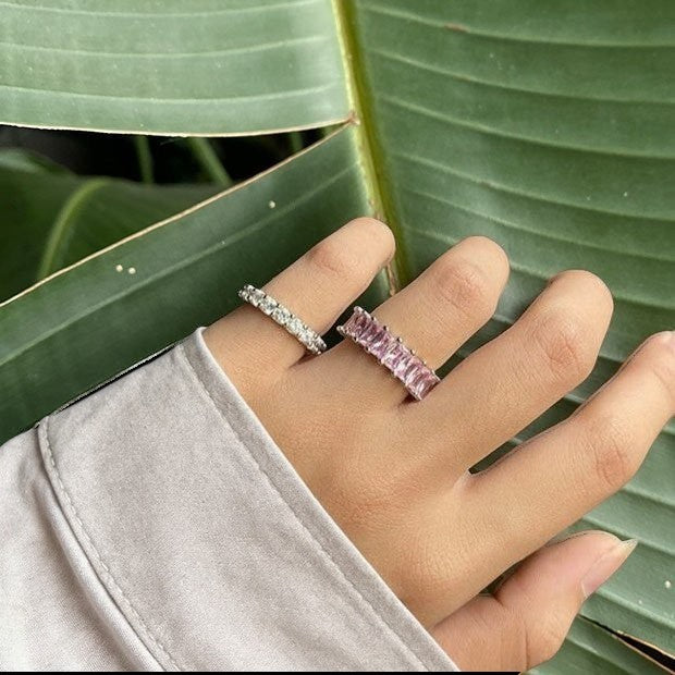 Amara Jewels pink baguette eternity ring in sterling silver with a polished finish.