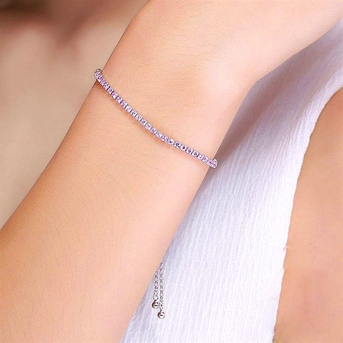 Amara Jewels sterling silver adjustable tennis bracelet with pink gemstones and slider clasp.