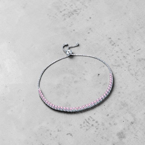 Amara Jewels sterling silver adjustable tennis bracelet with pink gemstones and slider clasp.