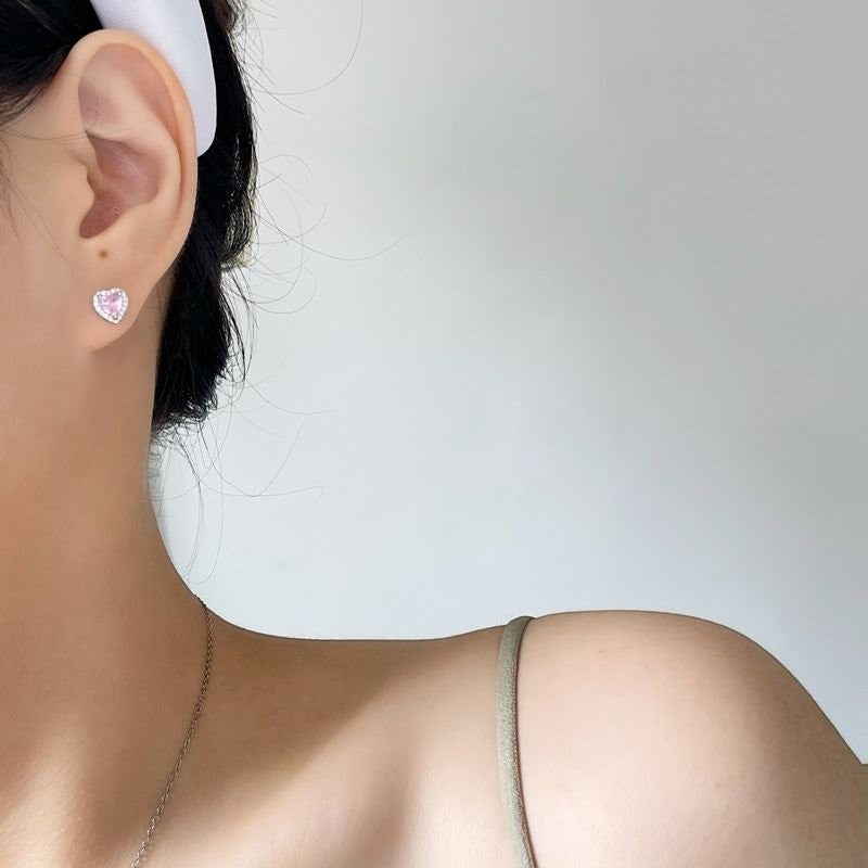 Amara Jewels pink heart-shaped cubic zirconia stud earrings with a halo of clear cubic zirconia accents, crafted from sterling silver.