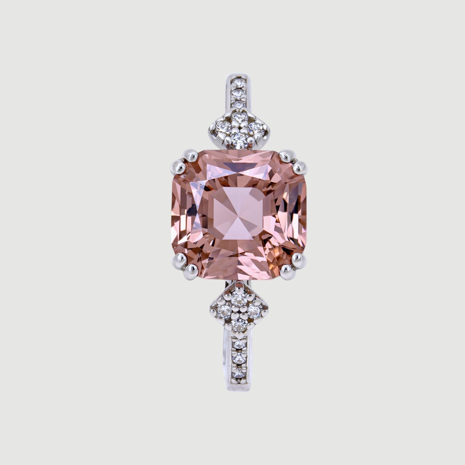 Amara Jewels 925 sterling silver ring with a square-cut pink sapphire and small zirconia accents on the band.