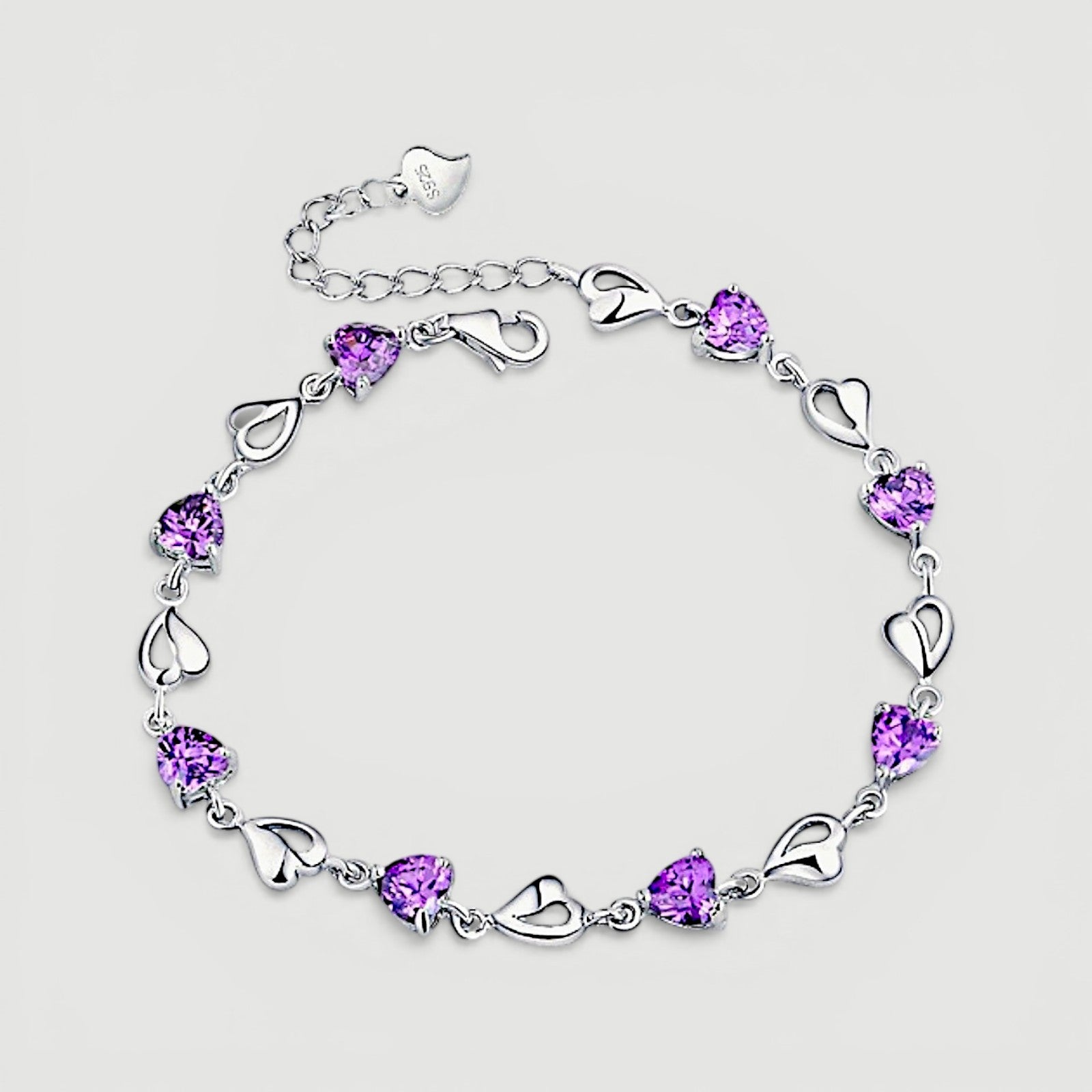 Amara Jewels sterling silver bracelet with purple heart-shaped links and shimmering stones.