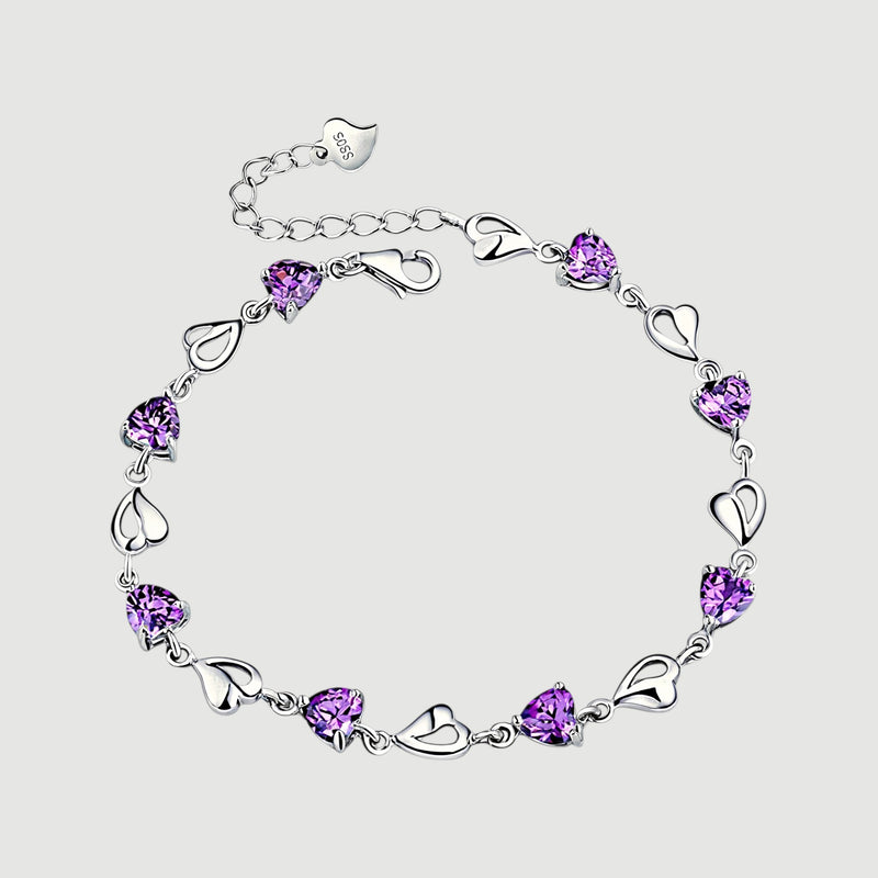 Amara Jewels sterling silver bracelet with purple heart-shaped links and shimmering stones.