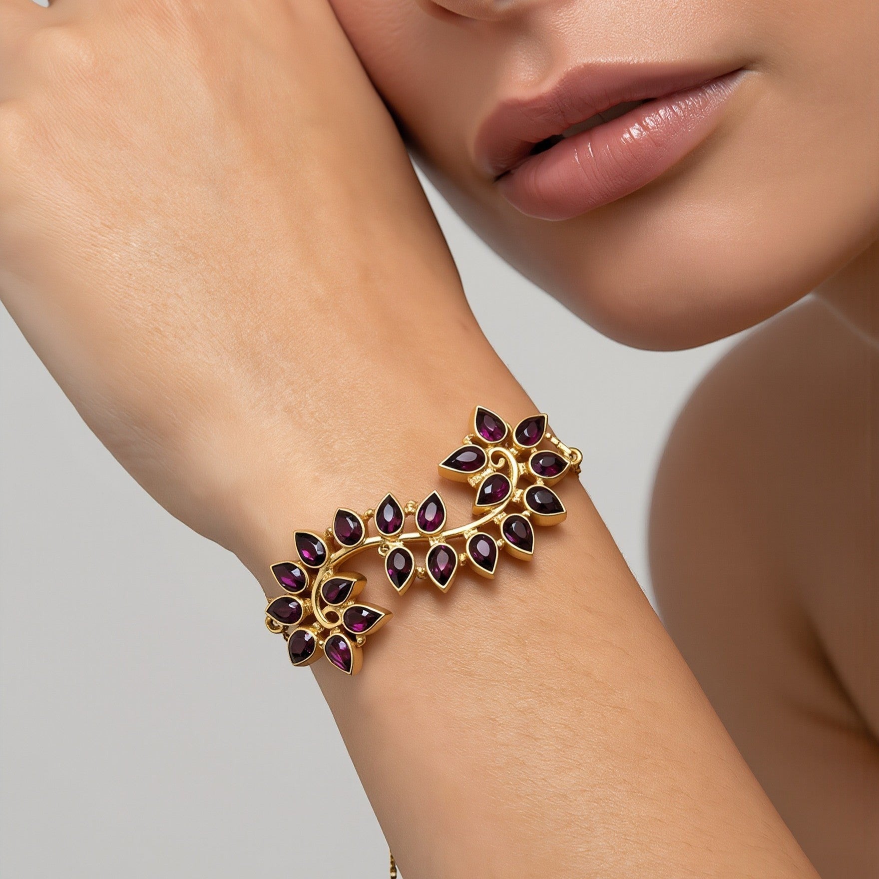 Amara Jewels Radiant Bloom Garnet Bracelet: Gold vermeil vine bracelet with pear-cut garnet stones. Adjustable slider.