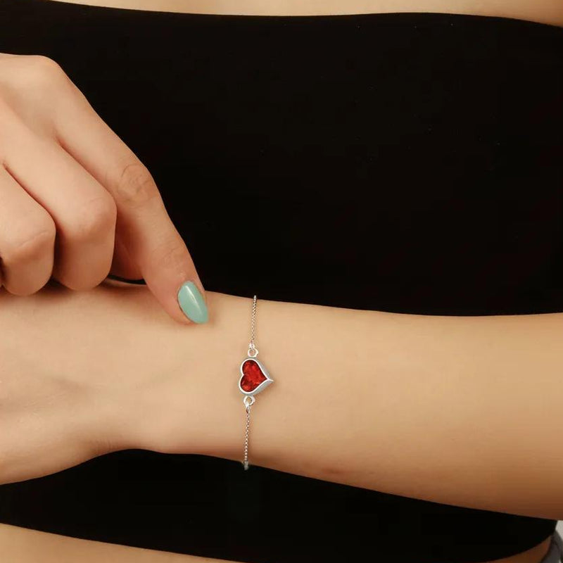 Amara Jewels red heart charm bracelet on a delicate 925 sterling silver adjustable chain.