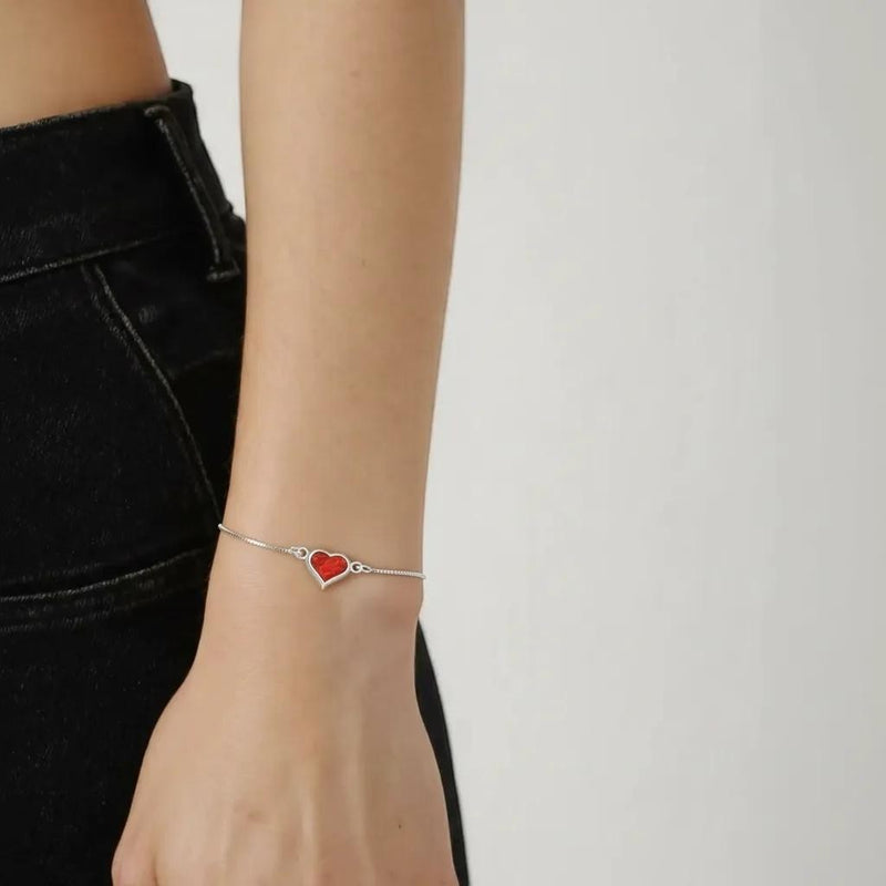 Amara Jewels red heart charm bracelet on a delicate 925 sterling silver adjustable chain.
