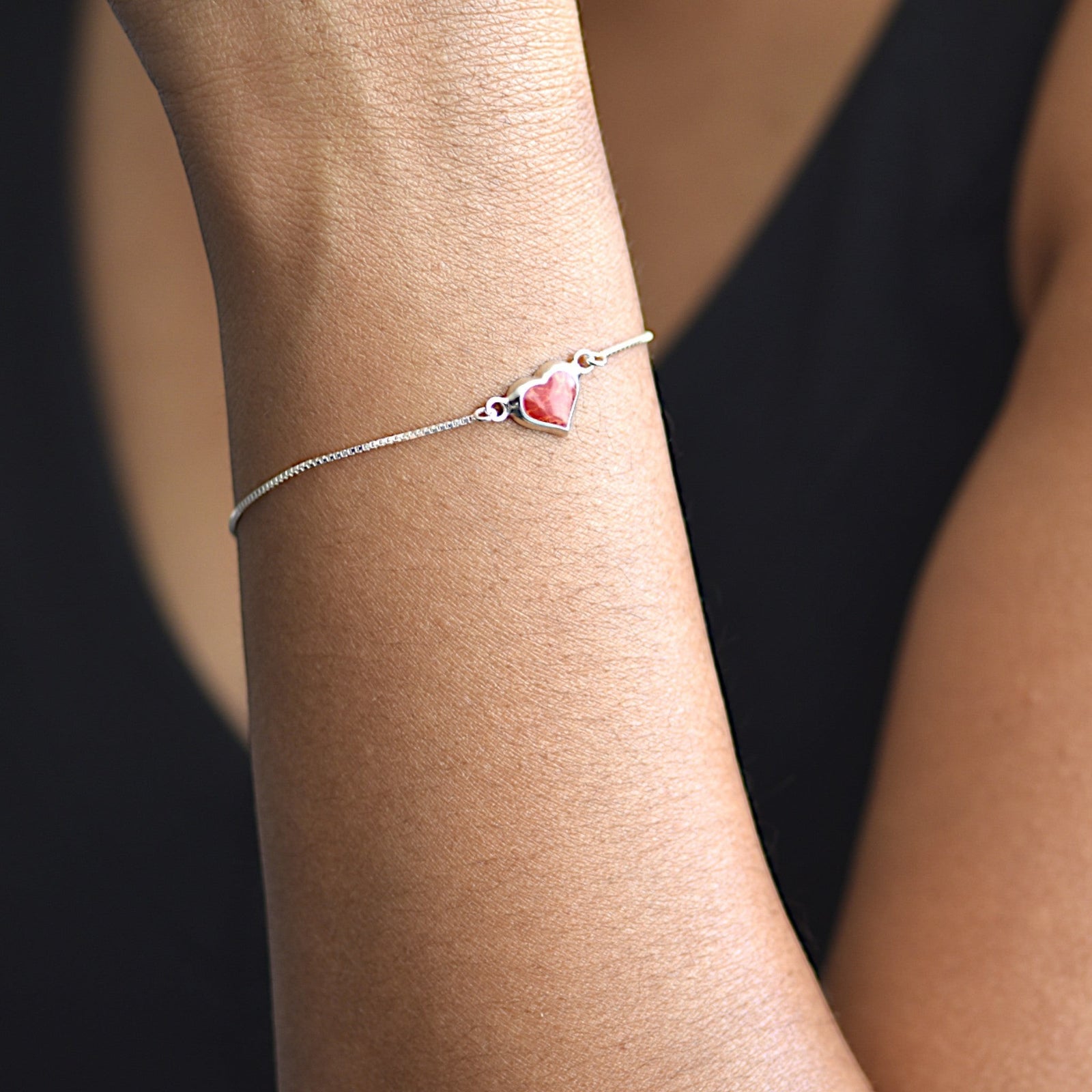 Amara Jewels red heart charm bracelet on a delicate 925 sterling silver adjustable chain.