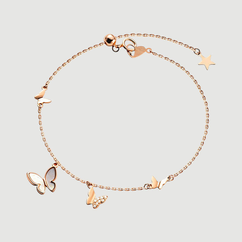 Amara Jewels rose gold plated sterling silver bracelet with butterfly and star charms, adjustable length.