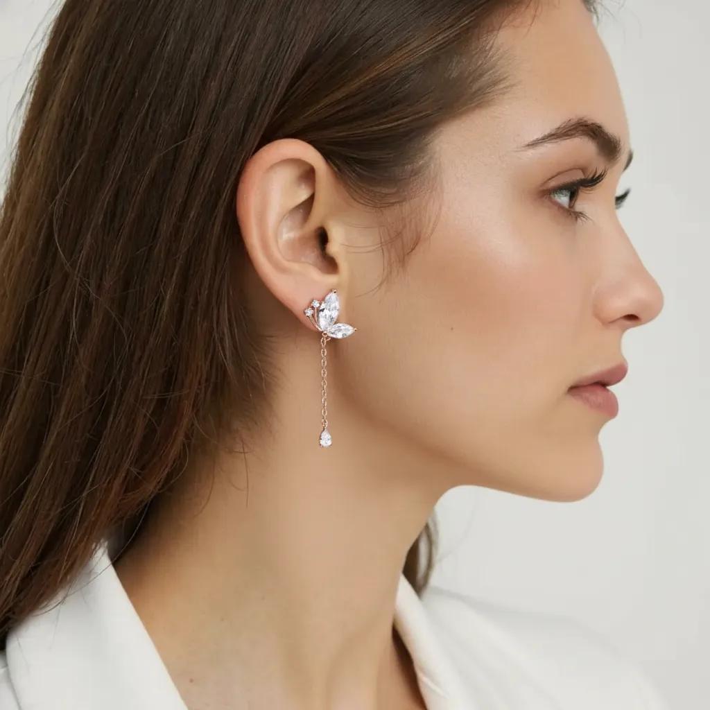 Amara Jewels rose gold plated sterling silver butterfly drop earrings with marquise and teardrop cubic zirconia stones.