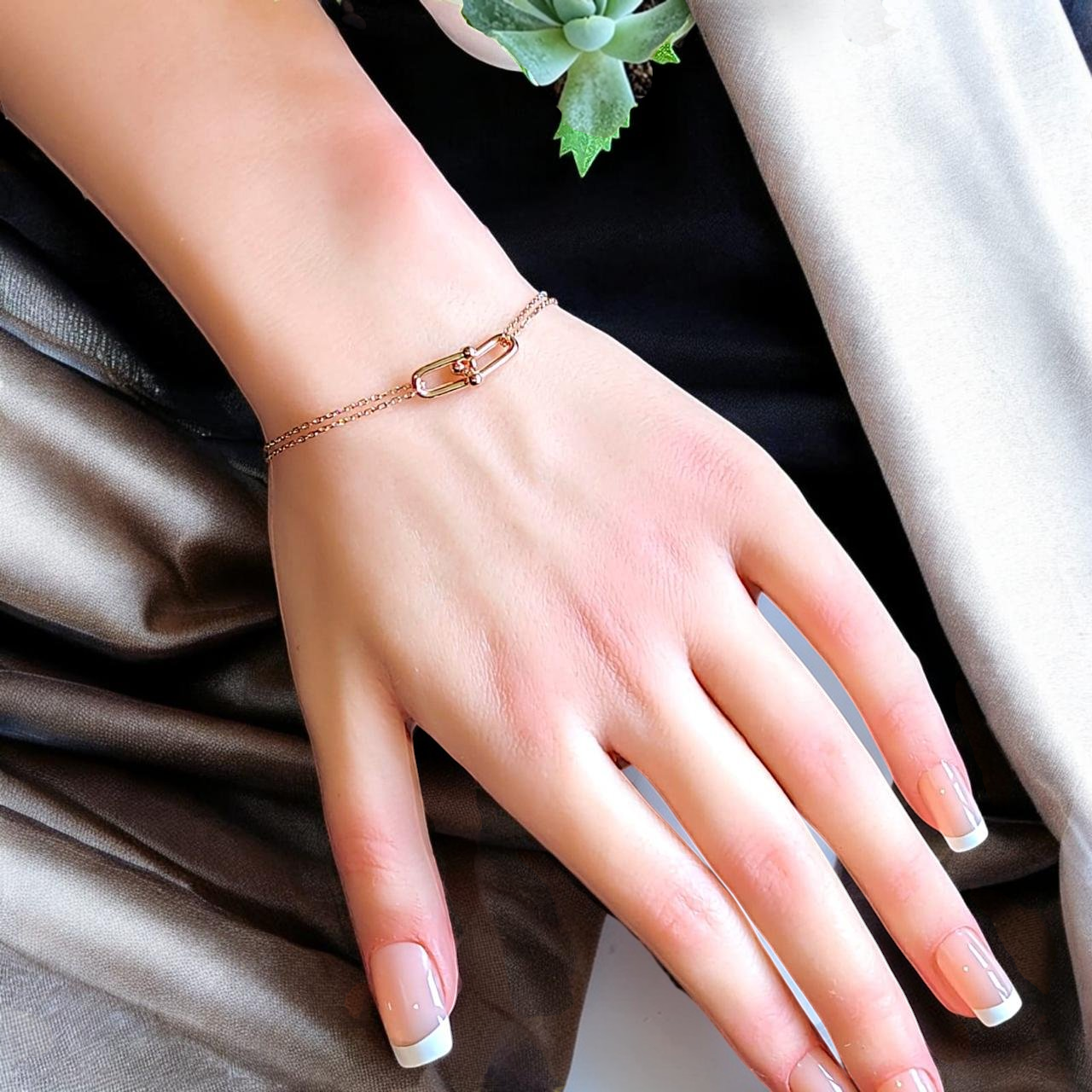 Amara Jewels rose gold plated sterling silver double chain link bracelet with adjustable clasp.