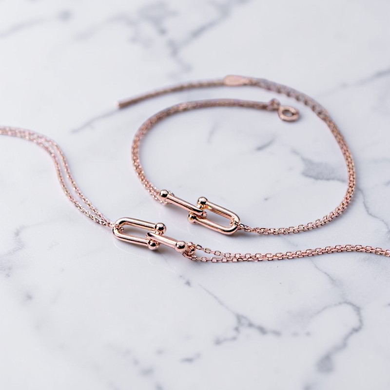 Amara Jewels rose gold plated sterling silver double chain link bracelet with adjustable clasp.