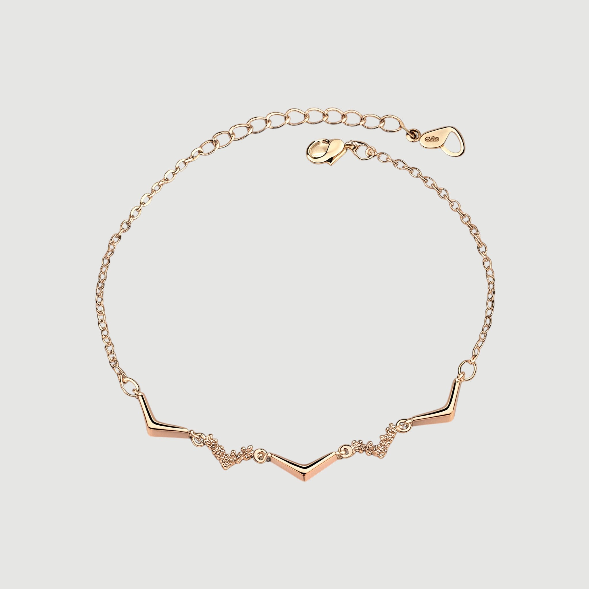 Amara Jewels rose gold chevron bracelet with zircon accents, delicate chain, minimalist design.