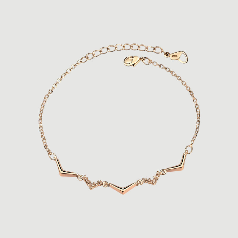 Amara Jewels rose gold chevron bracelet with zircon accents, delicate chain, minimalist design.