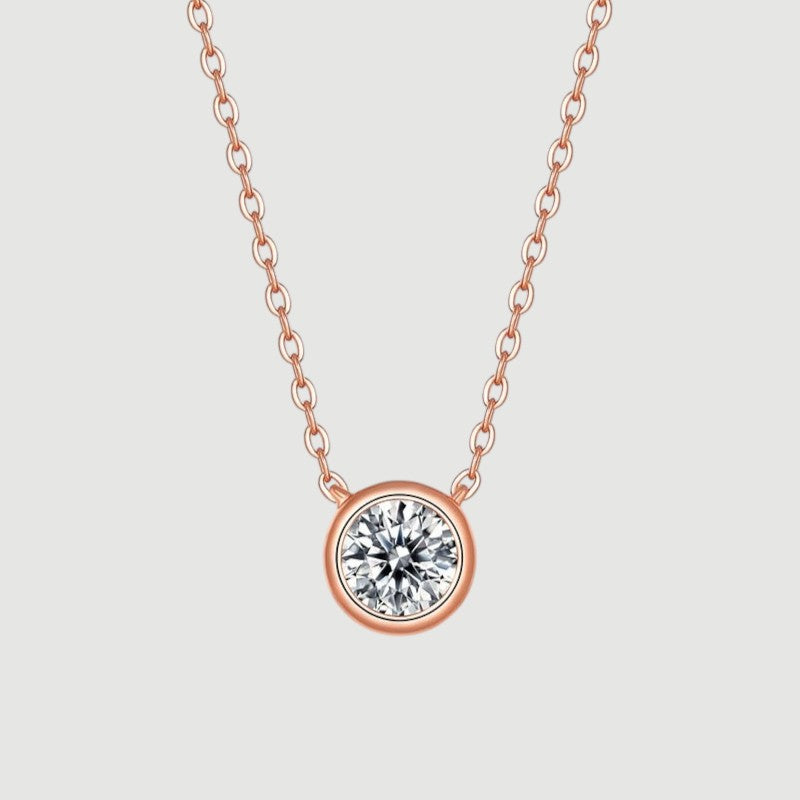Amara Jewels rose gold 925 sterling silver necklace with a bezel-set crystal pendant.