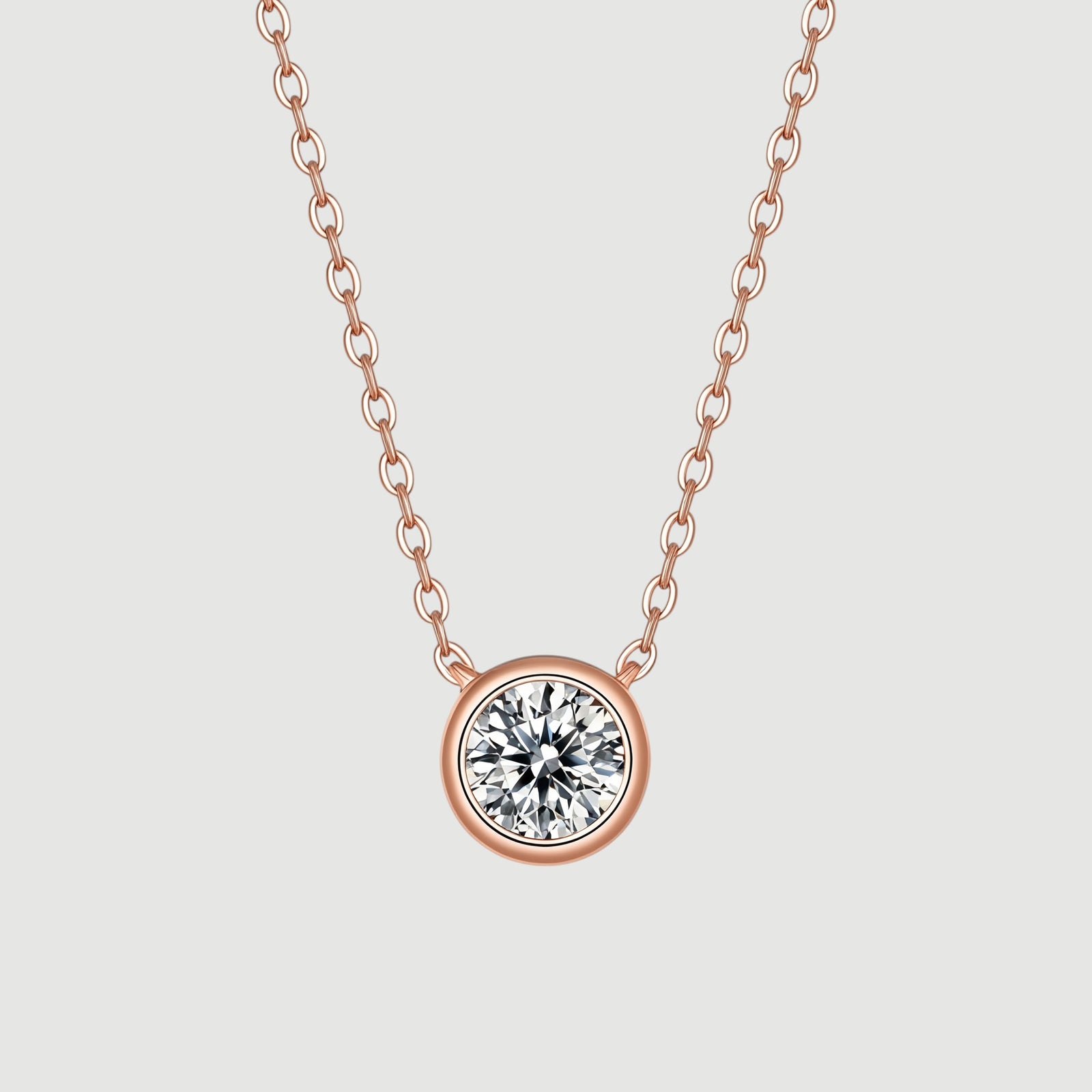 Amara Jewels rose gold 925 sterling silver necklace with a bezel-set crystal pendant.