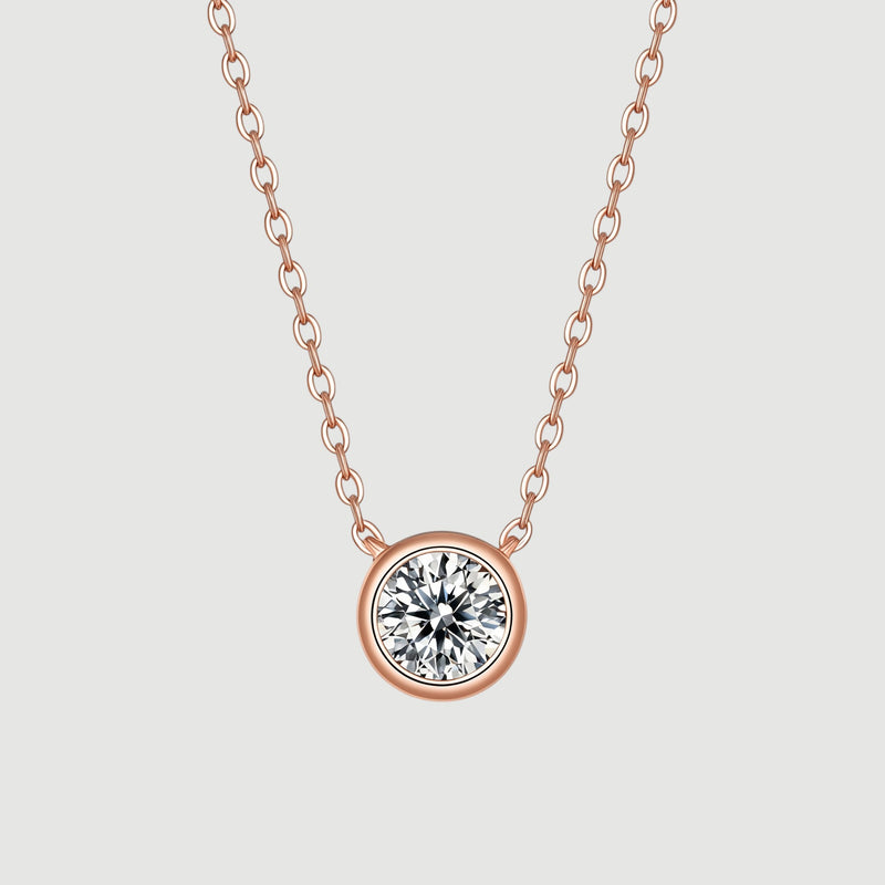 Amara Jewels rose gold 925 sterling silver necklace with a bezel-set crystal pendant.