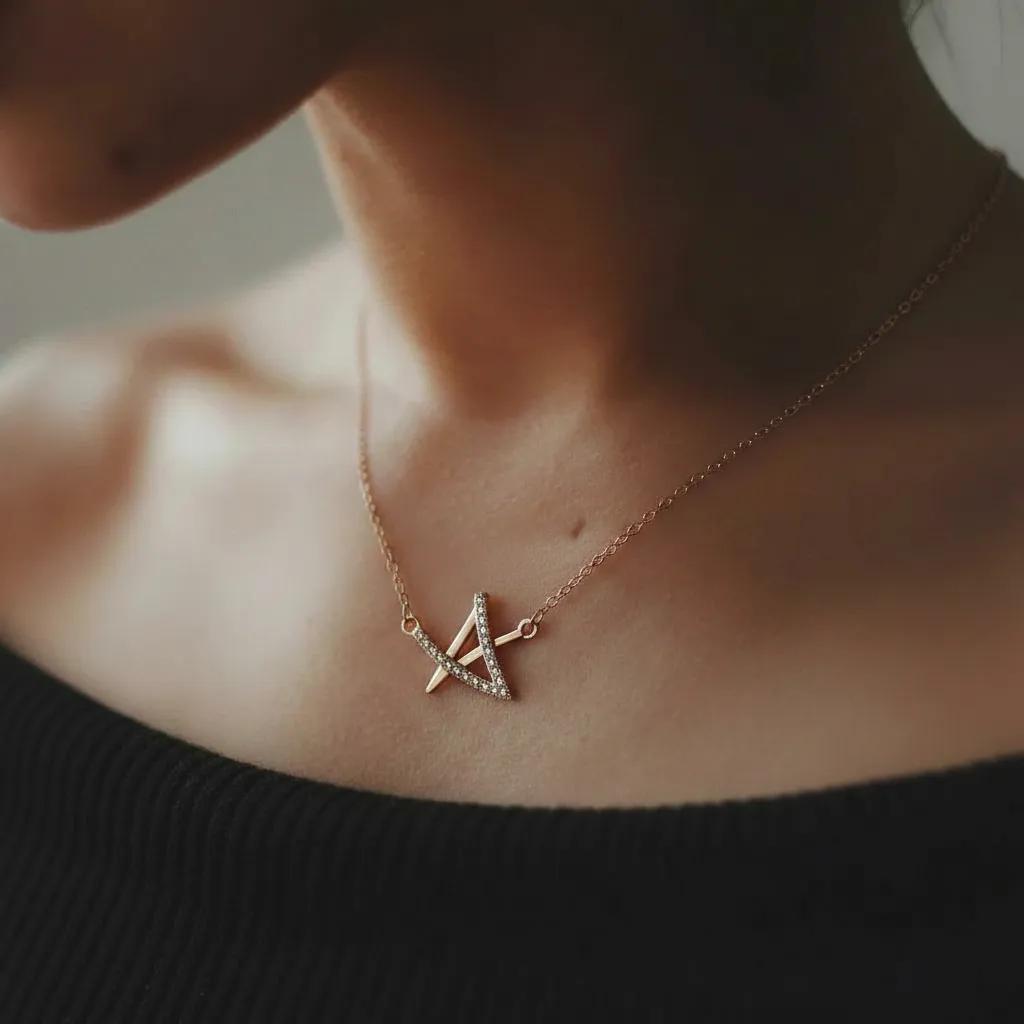 Amara Jewels rose gold geometric pendant necklace with crystals on a delicate chain.