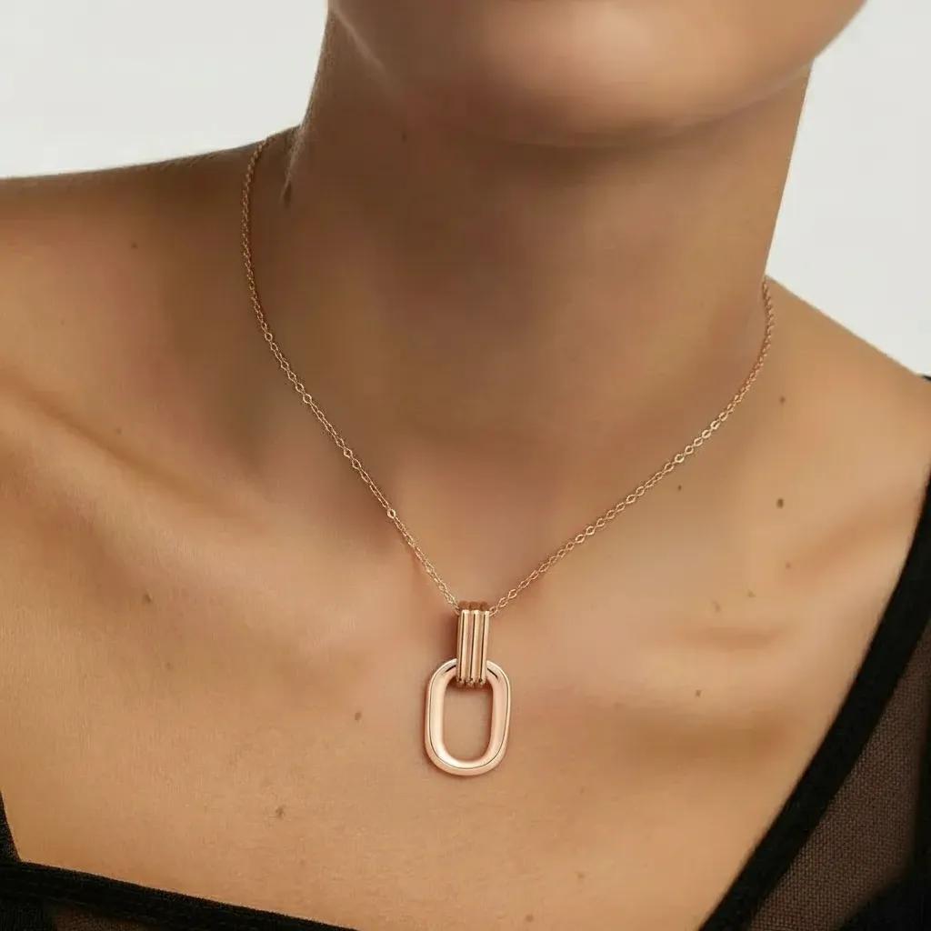 Amara Jewels rose gold plated sterling silver oval pendant necklace with open-link design.