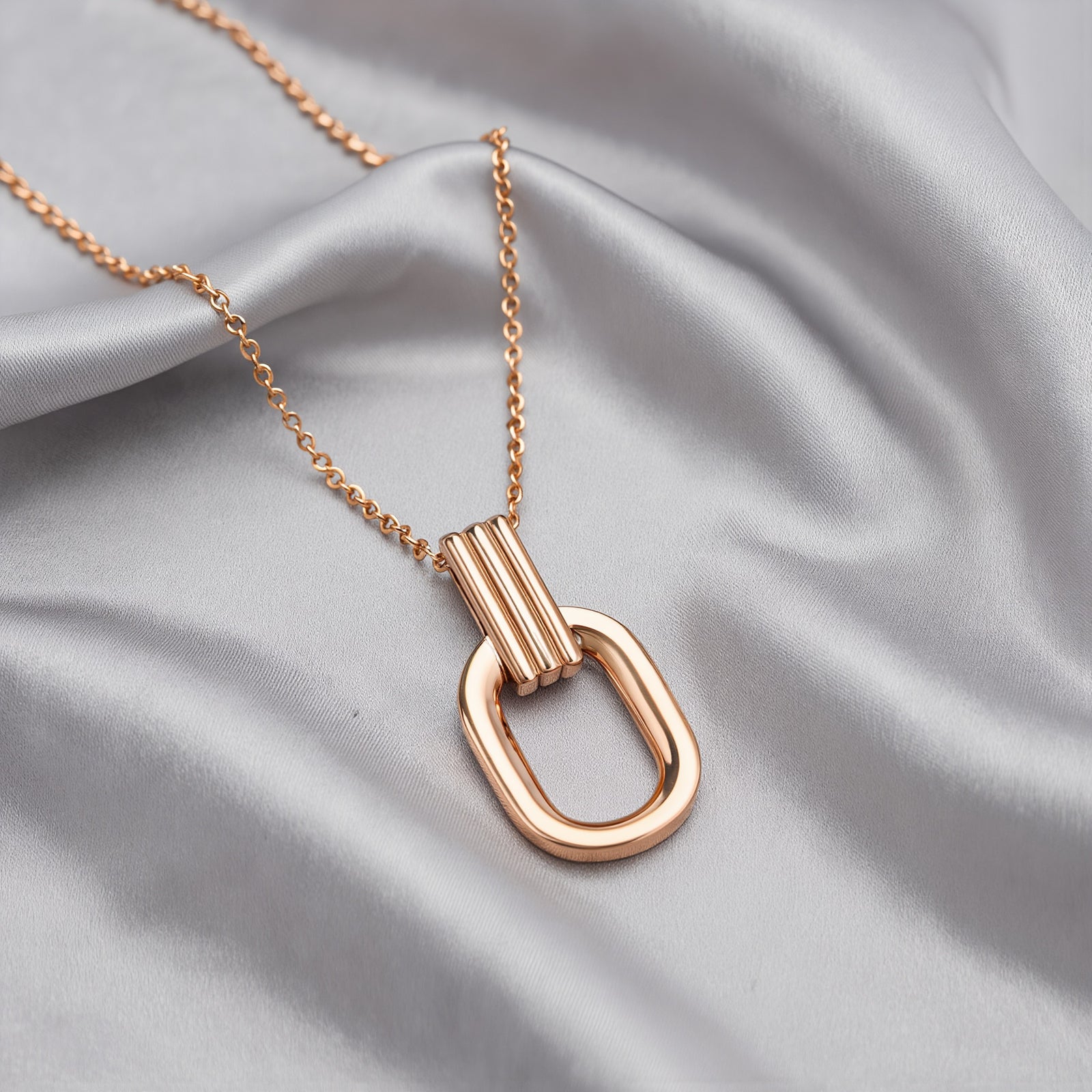 Amara Jewels rose gold plated sterling silver oval pendant necklace with open-link design.