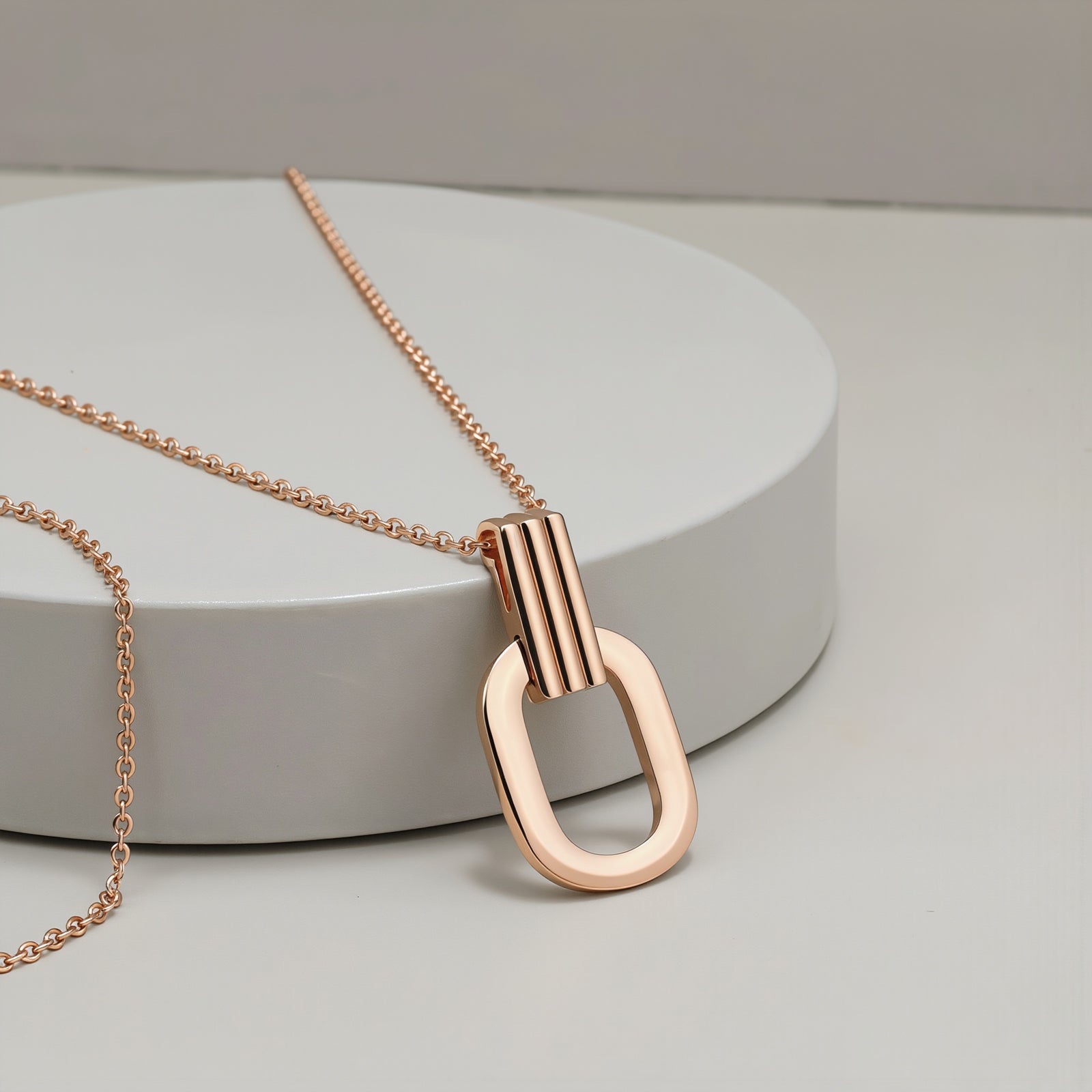 Amara Jewels rose gold plated sterling silver oval pendant necklace with open-link design.