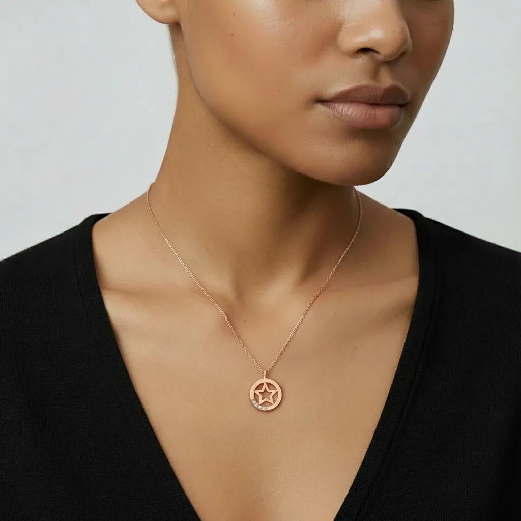Amara Jewels rose gold plated sterling silver necklace with a star pendant and cubic zirconia accents.