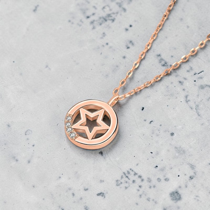 Amara Jewels rose gold plated sterling silver necklace with a star pendant and cubic zirconia accents.