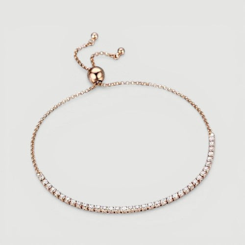 Amara Jewels rose gold adjustable tennis bracelet with white CZ stones and a slider clasp.