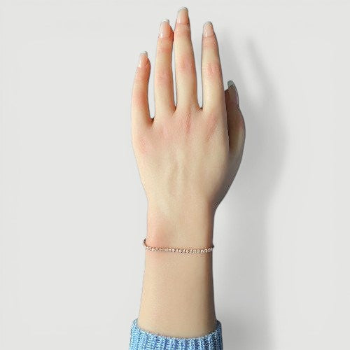 Amara Jewels rose gold adjustable tennis bracelet with white CZ stones and a slider clasp.