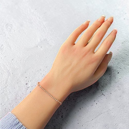 Amara Jewels rose gold adjustable tennis bracelet with white CZ stones and a slider clasp.